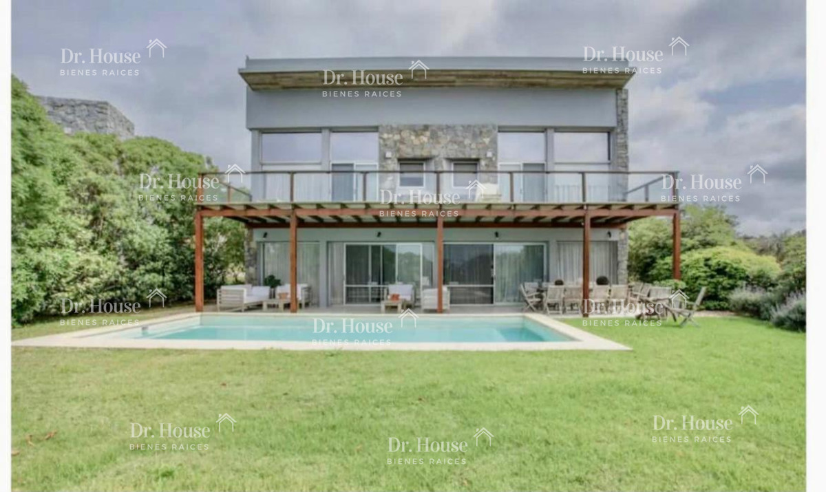exclusiva casa en barrio privado con vista al mar. manantiales. - drh348c