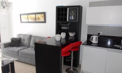 Unique dormitorio y medio - Edificio full servicios.