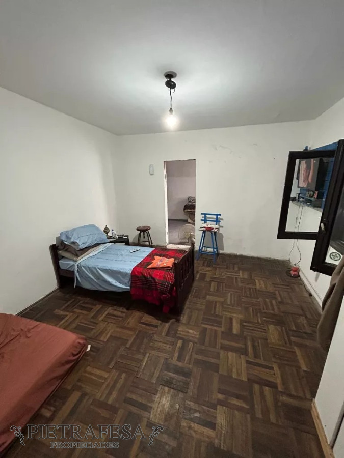 Casa ID.8716 - Casa en venta 2 dormitorios, 1 baño, fondo y cochera-Flor de Maroñas