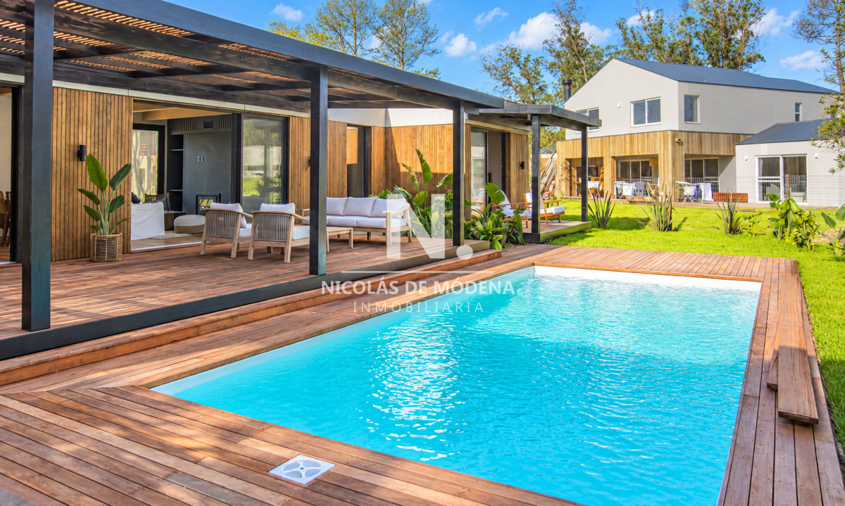 Hermosa casa de moderno diseño en venta en barrio privado Distrito 52, La Cañada de 4 dormitorios en venta. - NDM31428C