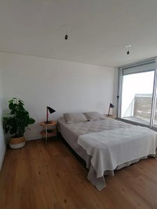 Venta Apartamento de 2 dormitorios en Malvín, piso alto. Edificio Distrito M