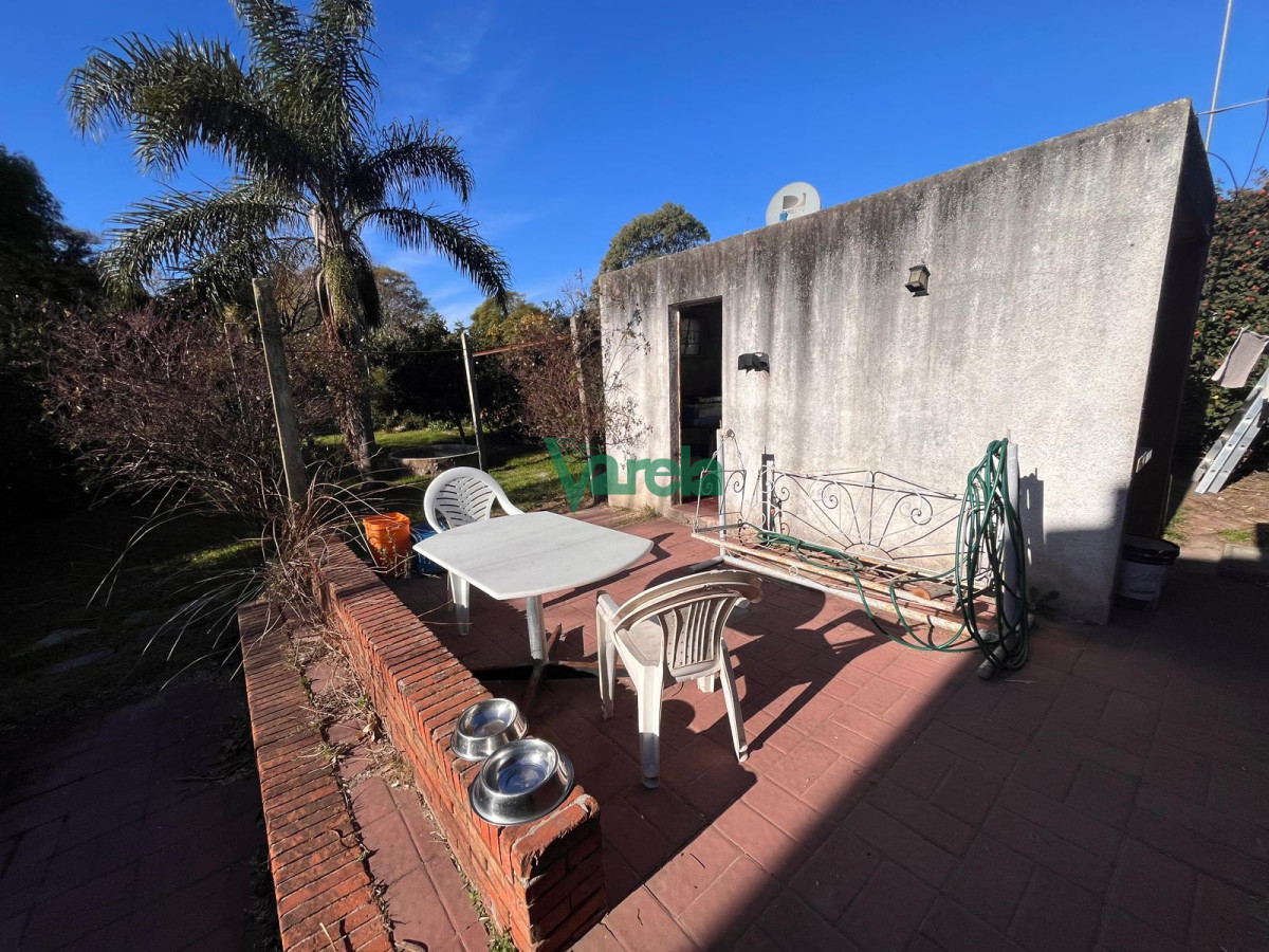 Casa ID.22687 - Venta casa en Solymar Sur, 2 dormitorios, living con hogar, fondo con parrillero y garage