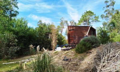 Terreno con pequeña habitación regularizada.