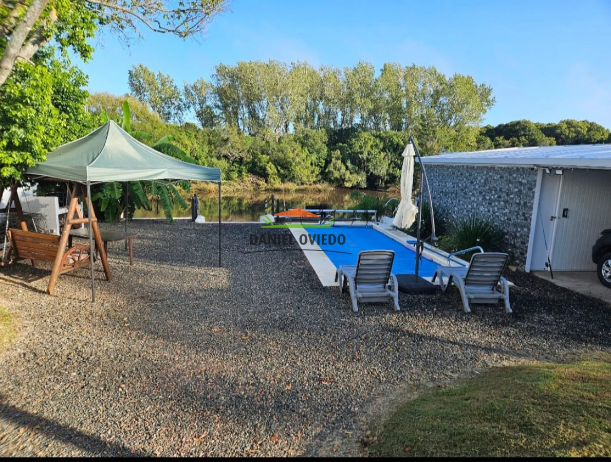 Casa ID.343/Excelente-casa-en-venta-con-piscina-y-muelle-a-arroyo-en-Boca-del-Cufr - Excelente casa en venta con piscina y muelle a arroyo en Boca del Cufré.