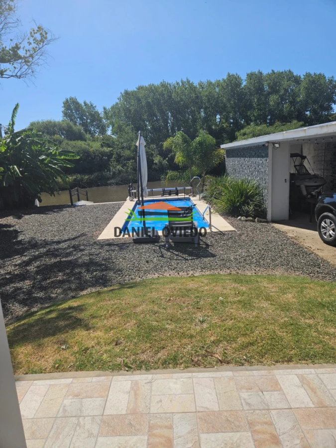 Casa ID.343/Excelente-casa-en-venta-con-piscina-y-muelle-a-arroyo-en-Boca-del-Cufr - Excelente casa en venta con piscina y muelle a arroyo en Boca del Cufré.