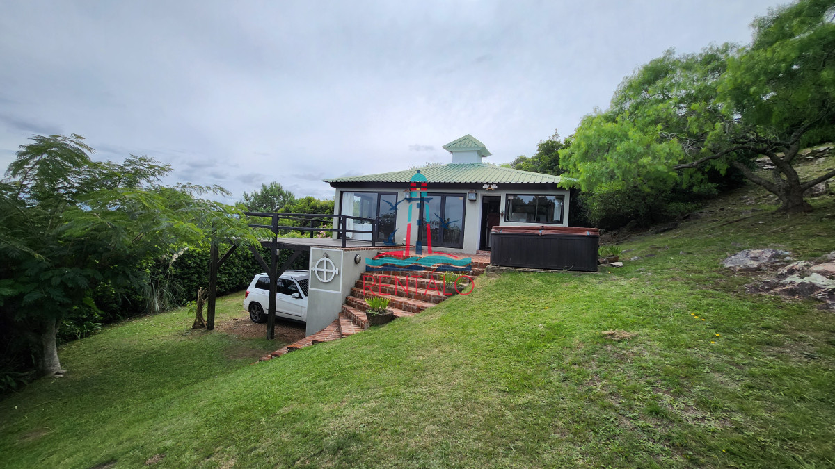 Casa ID.198 - Casa en venta 4 dormitorios en Las Cumbres vista a la Laguna del Sauce