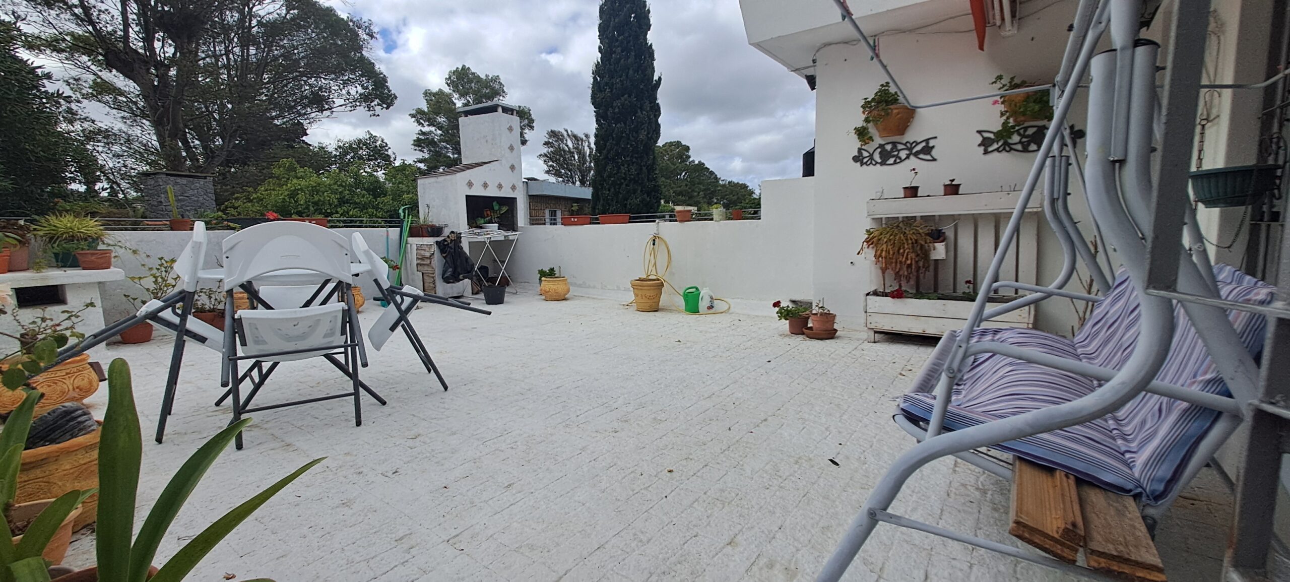  Alquiler Apartamento Carrasco 1 dormitorio Living  Estufa leña Gran terraza parrillero scarpelli